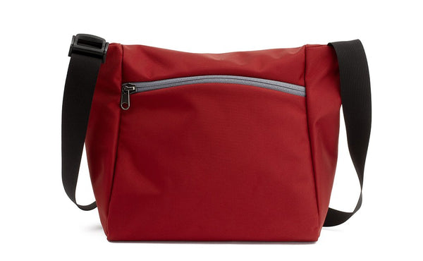 Reverse shot of an Icon in Mars Red 525 Ballistic with Northwest Sky (light grey) zippers.
